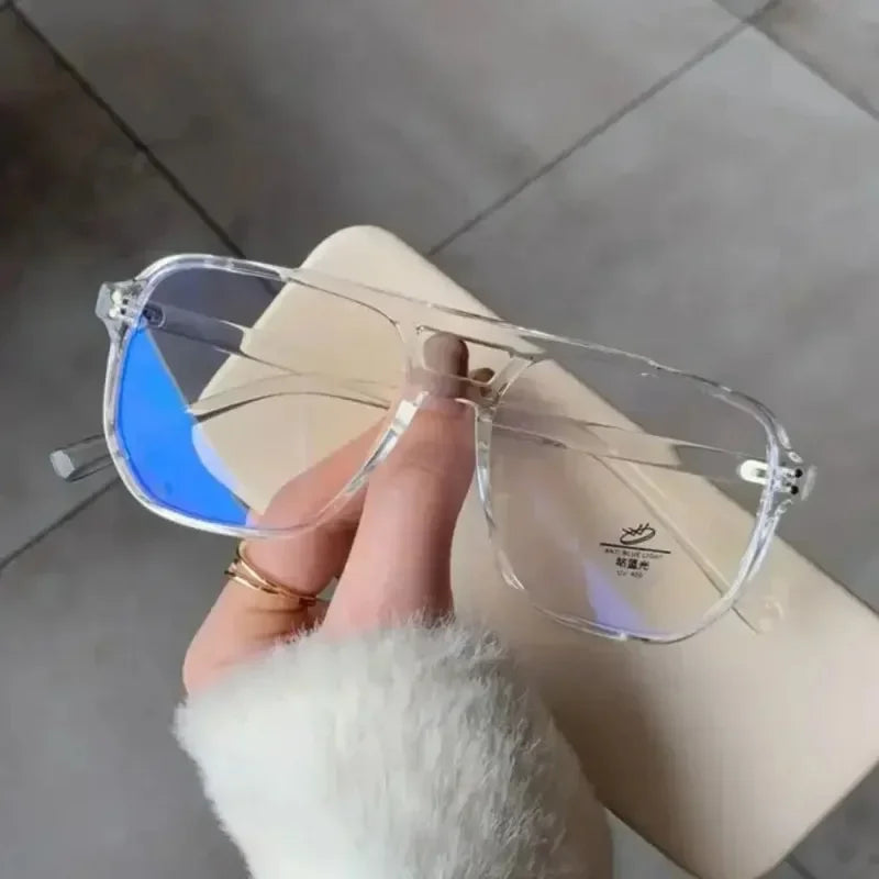1 unidad de gafas modernas con filtro de luz azul, nuevas, para hombre y mujer, con montura transparente para usar frente a pantallas de ordenador, estilo retro y forma cuadrada.